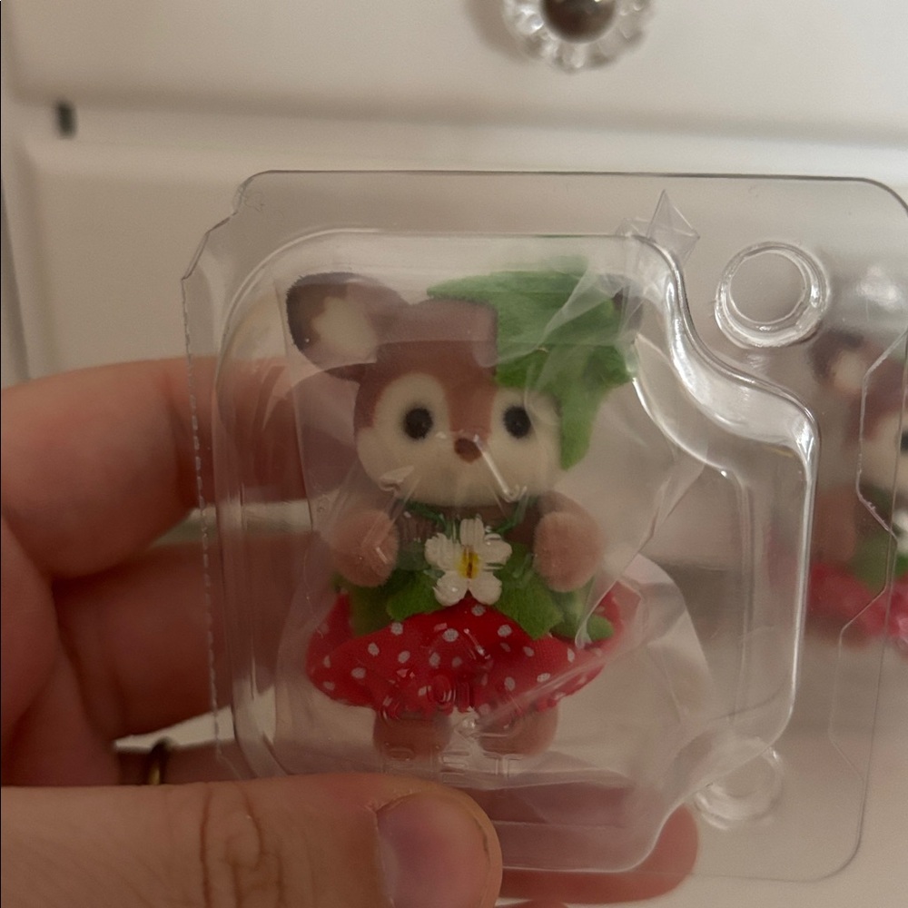 Calico critter Four Bear Figurines in Red and Green Outfits and a koala